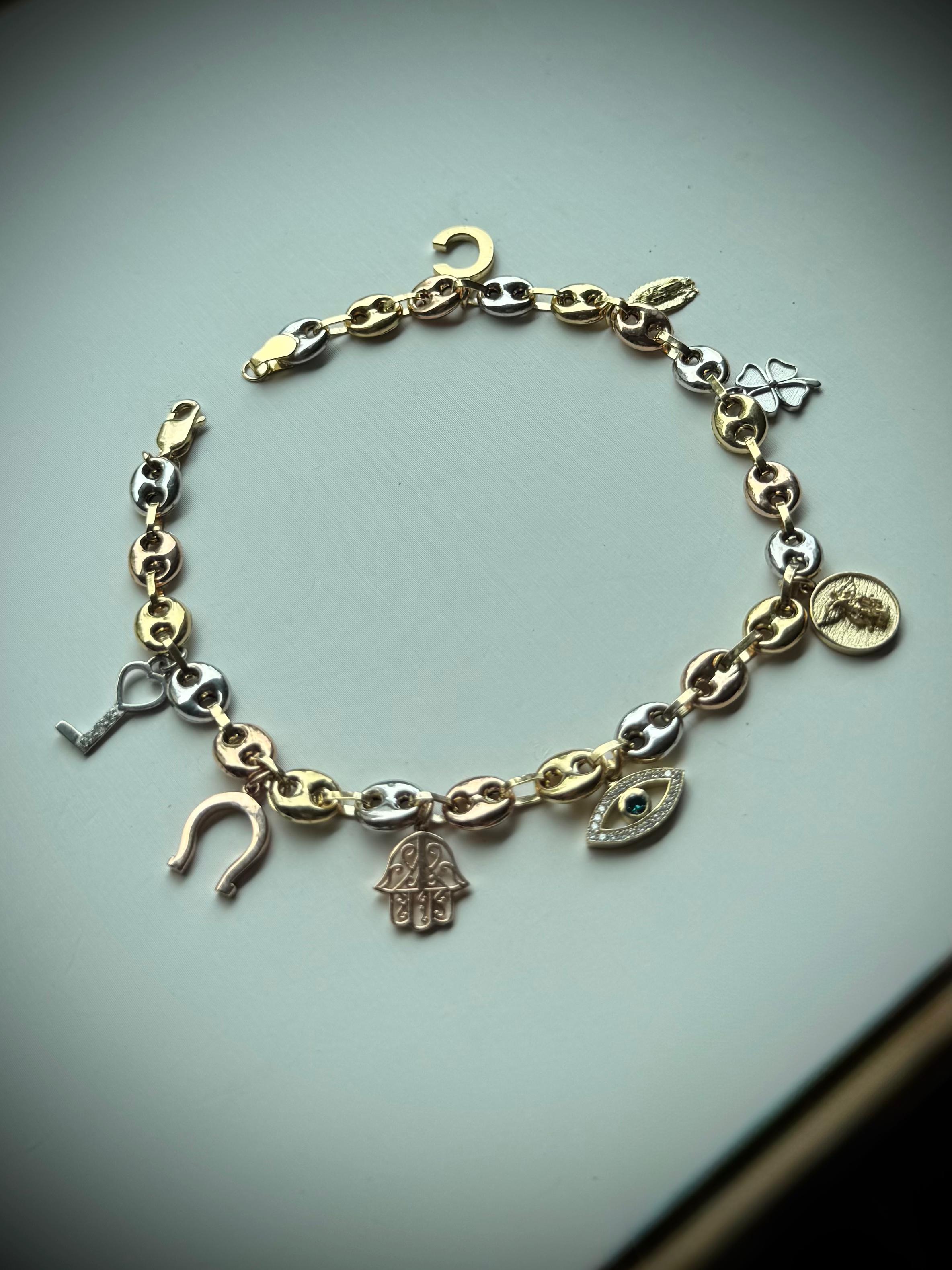 TOBILLERA 8 AMULETOS 0,22 CTS DIAMANTES / ORO AMARILLO 13GR