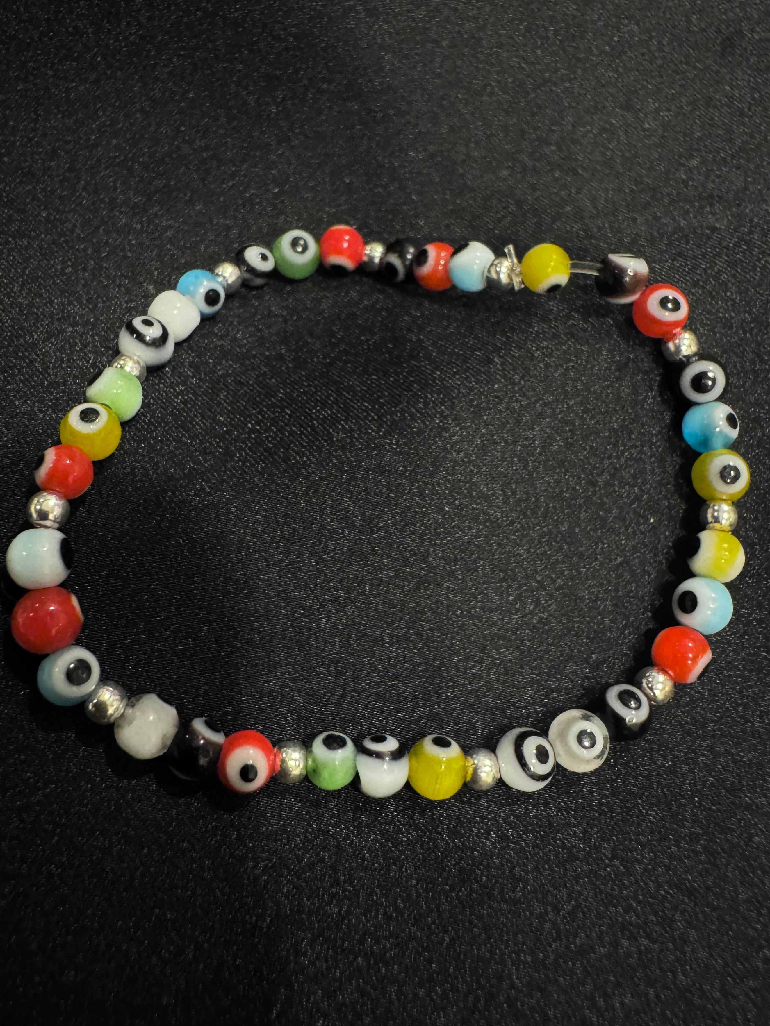 PULSO OJO MULTICOLOR  NYLON 18 CM